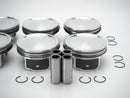 Performance-enhancing oversized piston set with rings +0.75mm for Jaguar XK models, designed for durability.